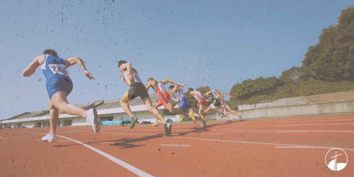 6 runners in a line on a track.