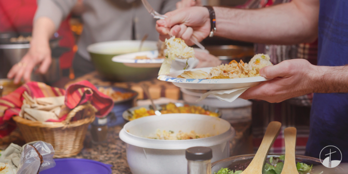 A view of the table full of different food items in colorful containers for participants to choose from.
